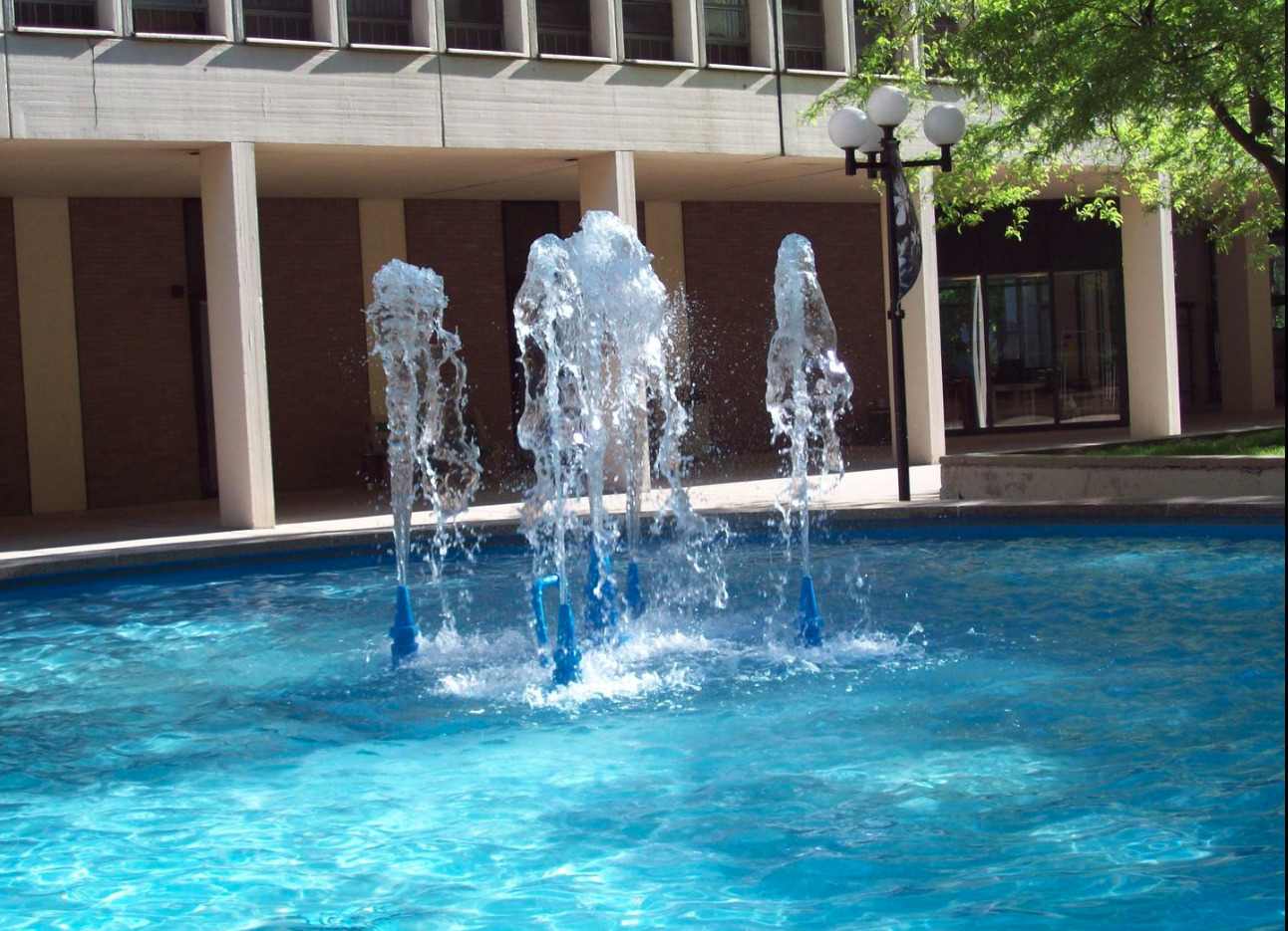 1451 East 55th Street, Unit 1030N Chicago, IL 60615 - Photo 3 of 18 a front view of a house with a yard