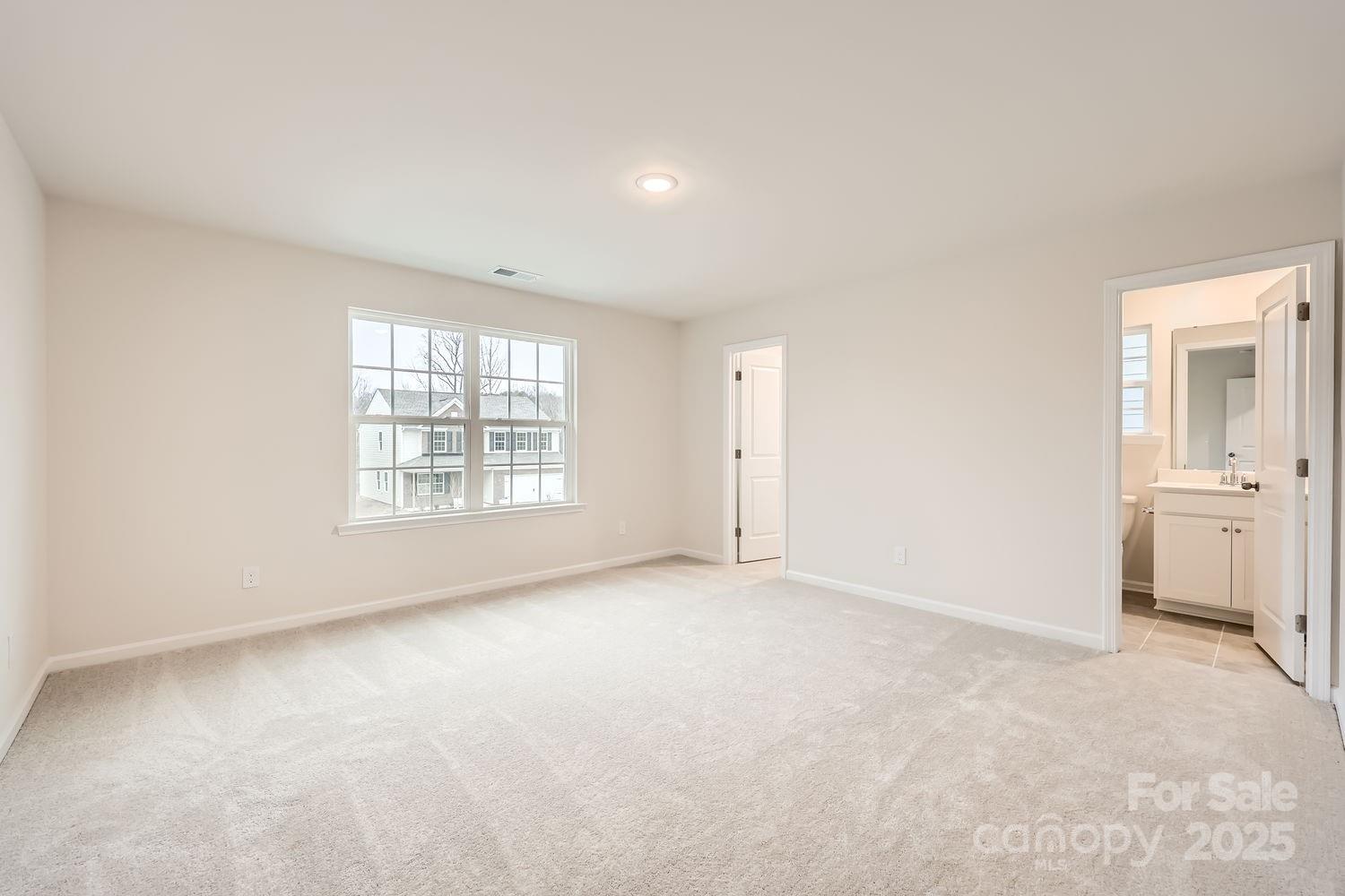 5720 Olive Bch Road Kannapolis, NC 28081 - Photo 10 of 13 an empty room with windows and cabinet
