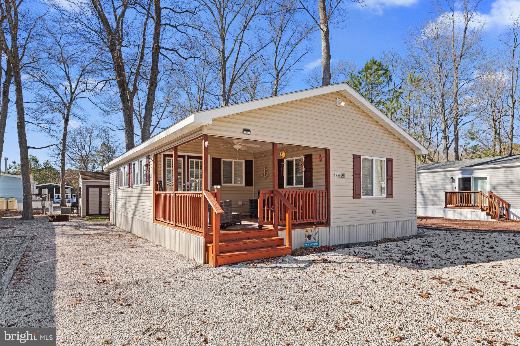 a view of a house with a yard covered in snow