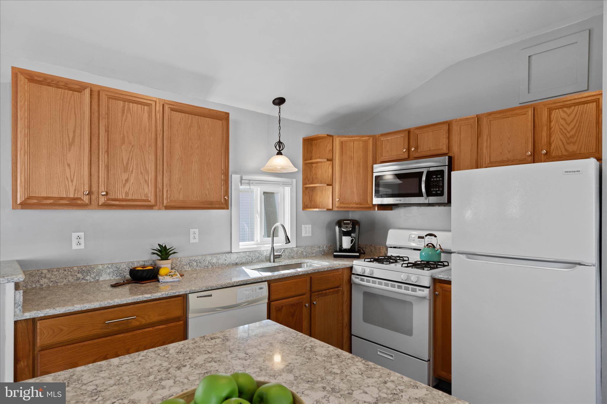 25760 Blue Ridge Street Millsboro, DE 19966 - Photo 16 of 64 a kitchen with stainless steel appliances granite countertop a refrigerator sink and stove