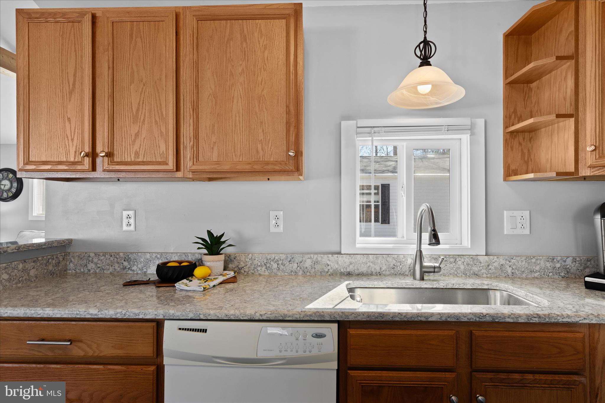25760 Blue Ridge Street Millsboro, DE 19966 - Photo 22 of 64 a kitchen with stainless steel appliances granite countertop a sink and a wooden cabinets