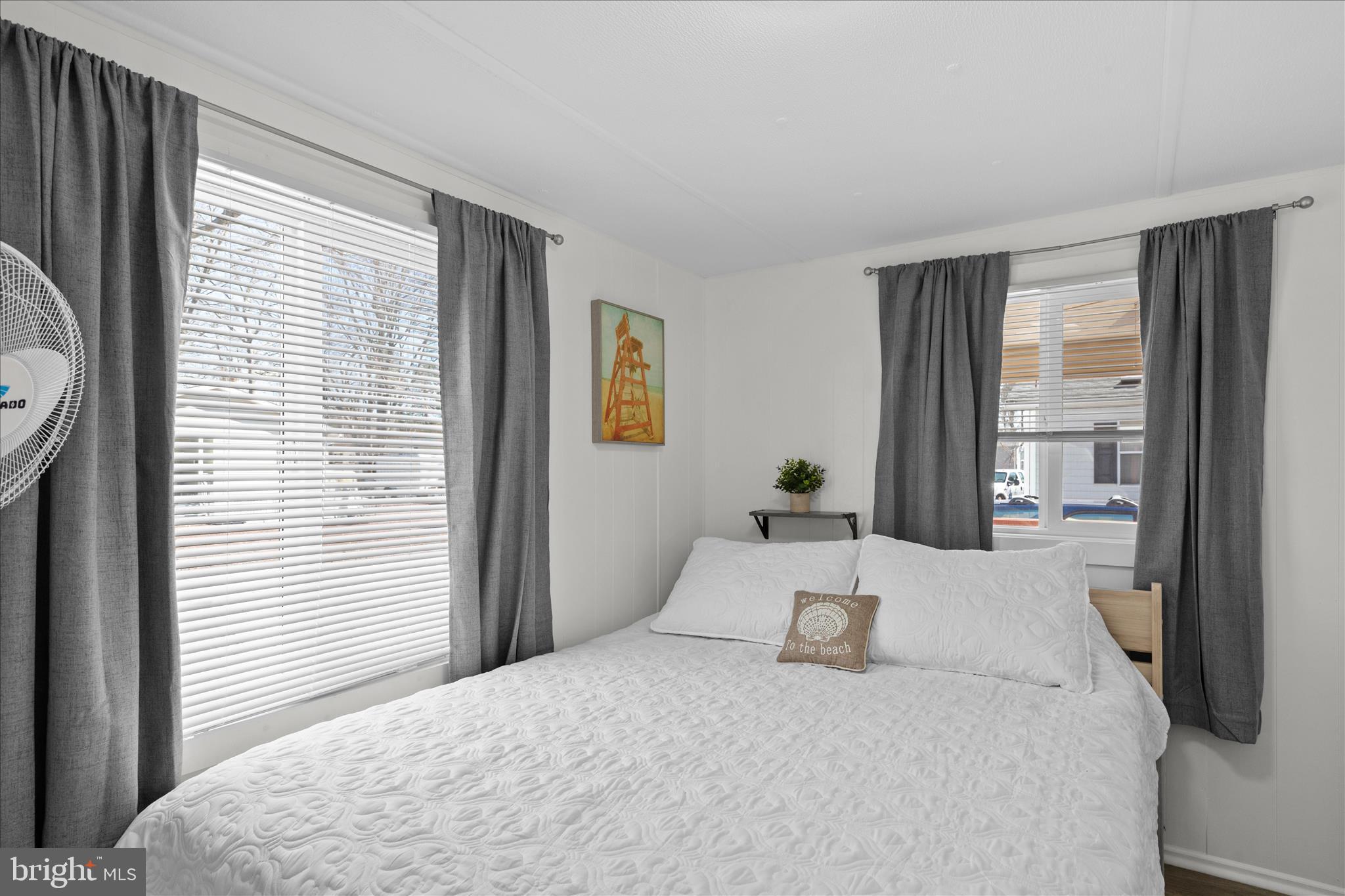 25760 Blue Ridge Street Millsboro, DE 19966 - Photo 31 of 64 a bedroom with a large bed and a window