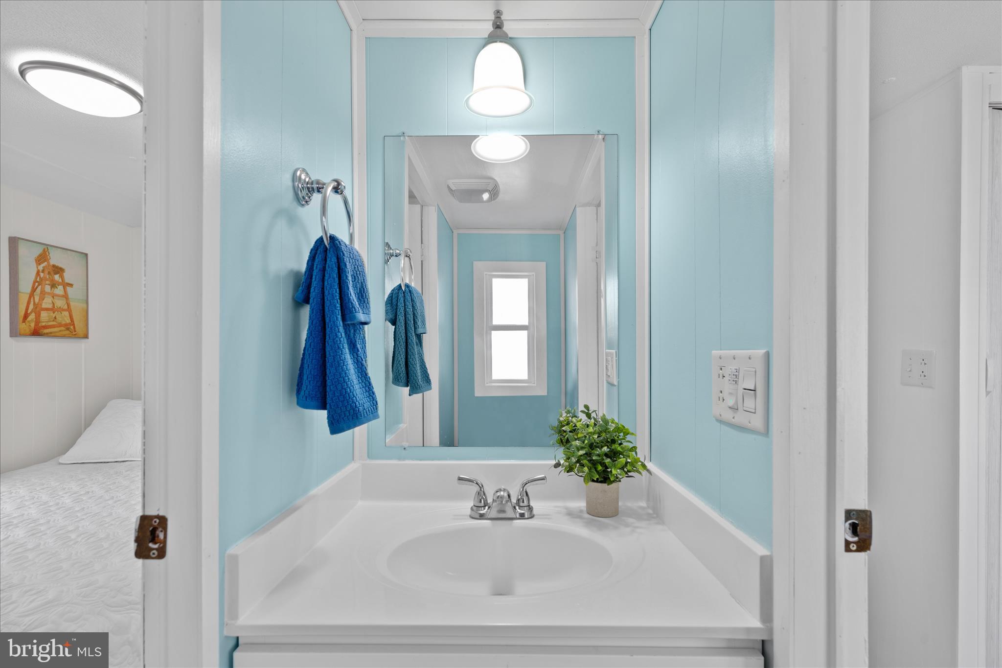 25760 Blue Ridge Street Millsboro, DE 19966 - Photo 35 of 64 a bathroom with a sink and a mirror