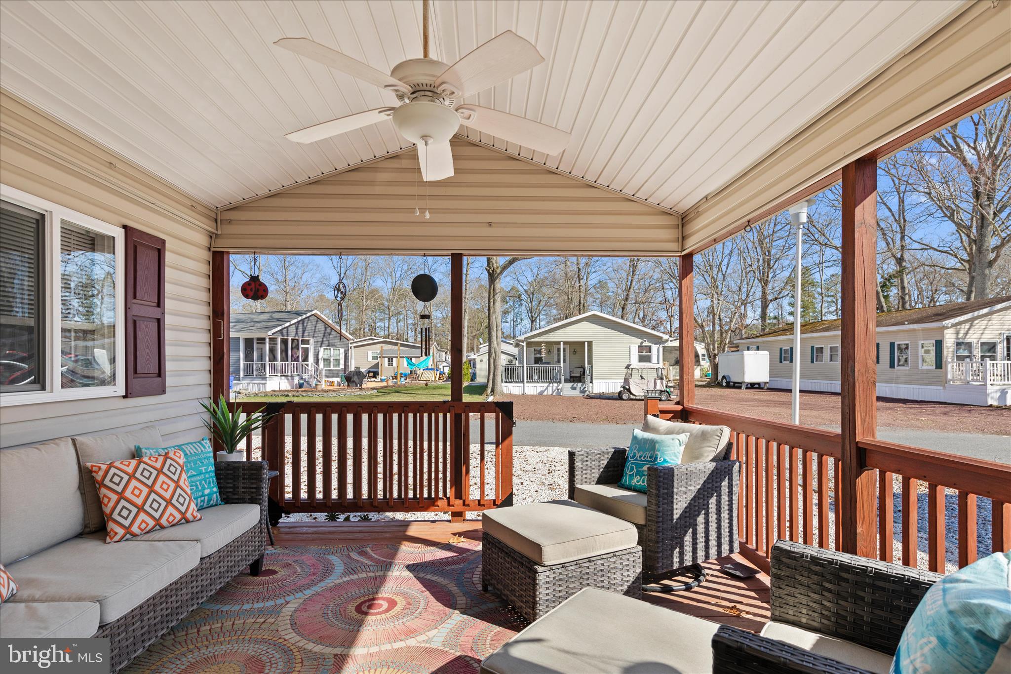 25760 Blue Ridge Street Millsboro, DE 19966 - Photo 41 of 64 a living room with furniture a ceiling fan and a large window