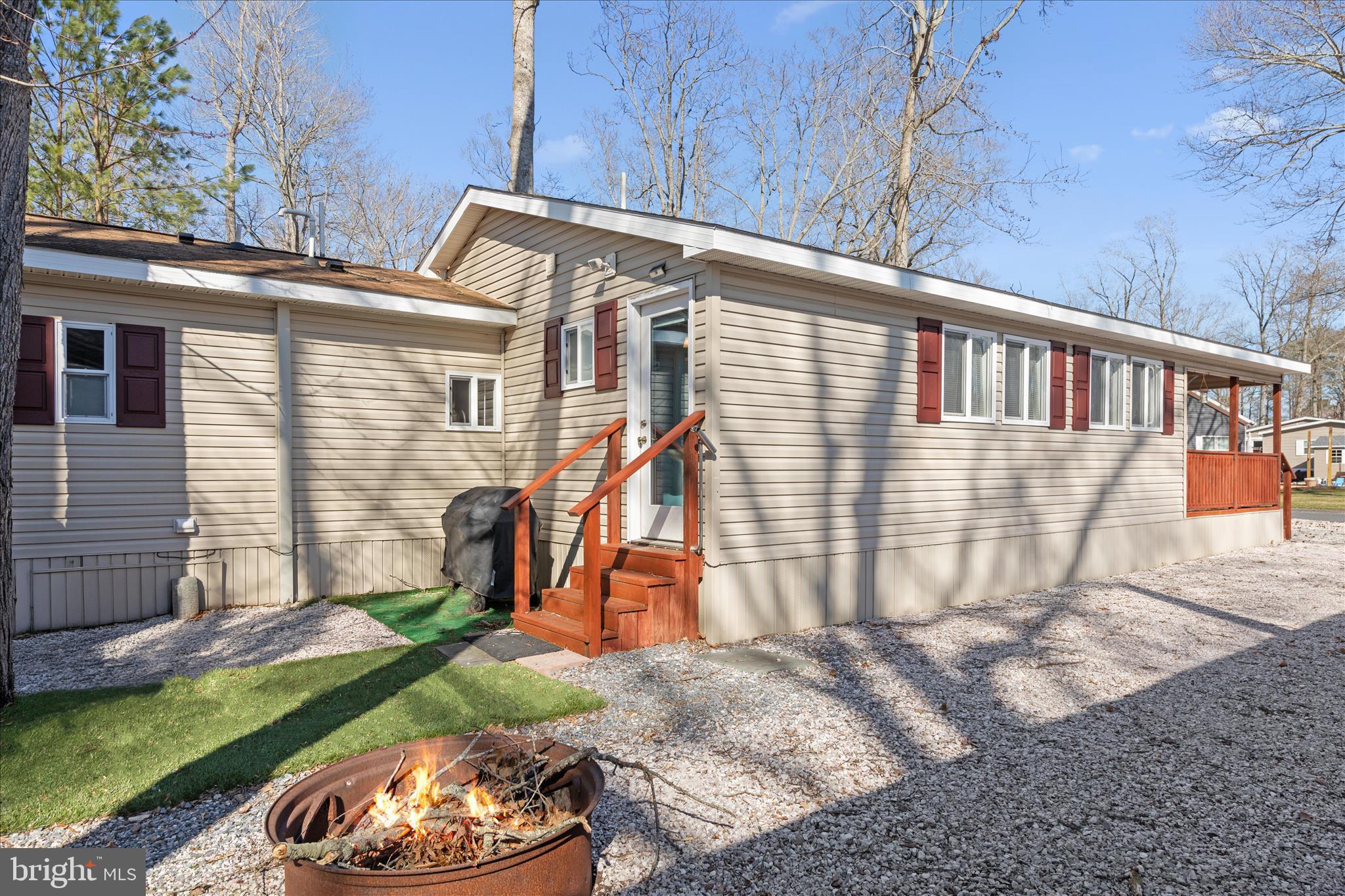 25760 Blue Ridge Street Millsboro, DE 19966 - Photo 46 of 64 a backyard of a house with barbeque oven
