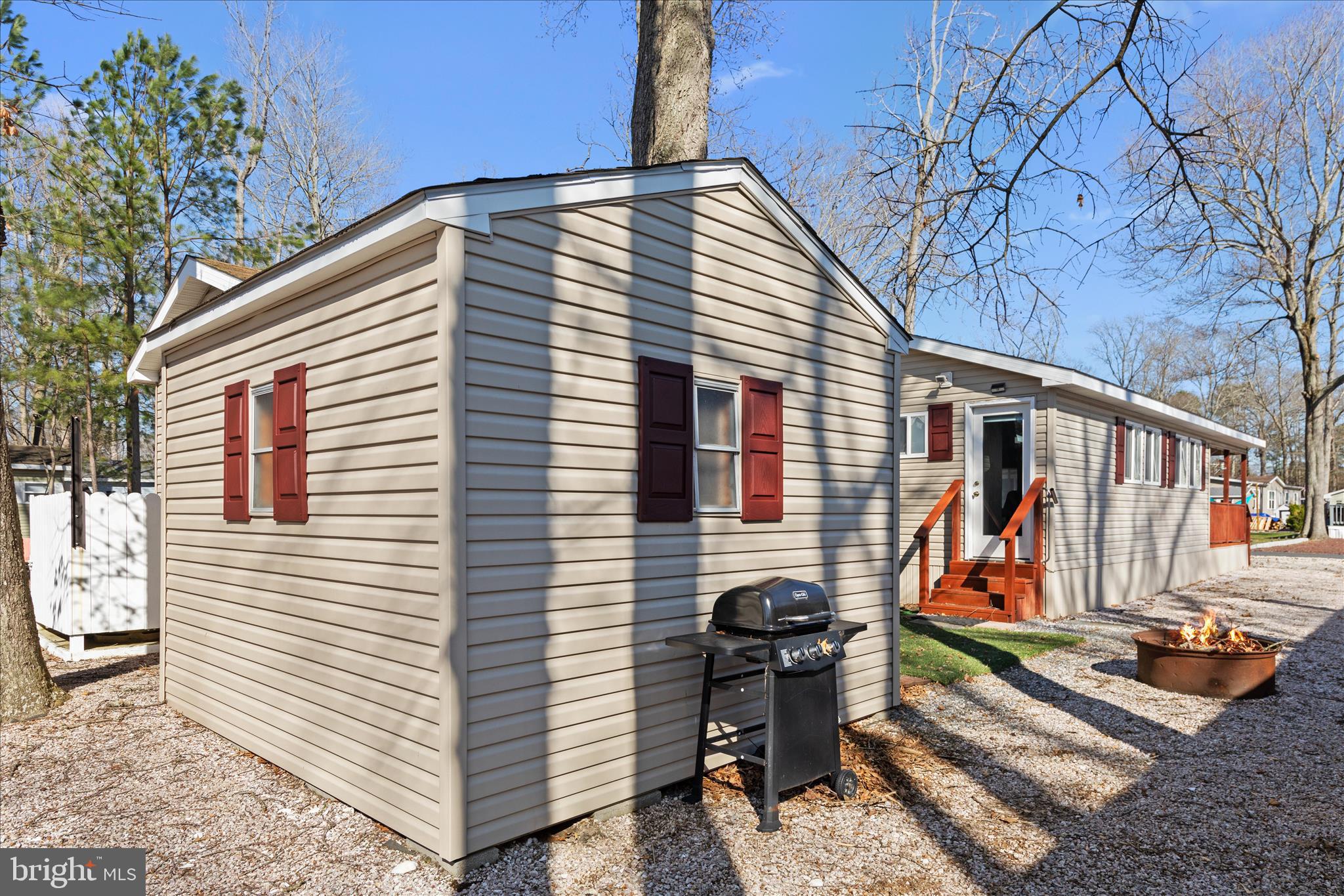 25760 Blue Ridge Street Millsboro, DE 19966 - Photo 47 of 64 a view of backyard with wooden stairs and a large tree
