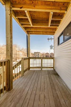 a view of a balcony with furniture