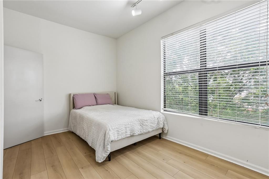 5300 Peachtree Road, Unit 3506 Atlanta, GA 30341 - Photo 17 of 25 a bedroom with a bed and a window