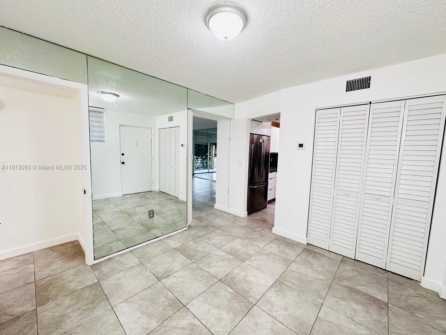 3490 Foxcroft Road, Unit B208 Miramar, FL 33025 - Photo 14 of 32 a view of a walk in closet
