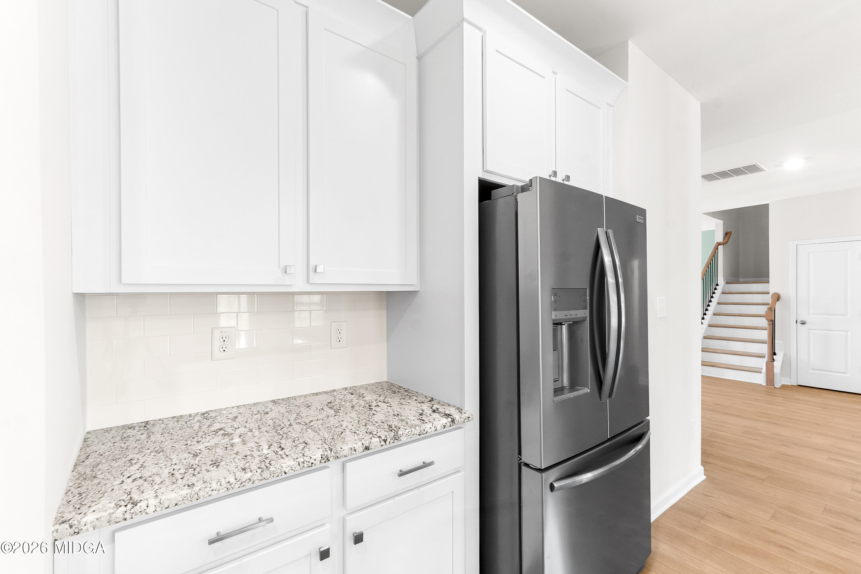 5393 Felles Way, Unit 359 Forsyth, GA 31029 - Photo 16 of 54 a kitchen with granite countertop stainless steel appliances and refrigerator