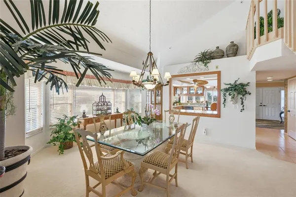 a bathroom with a granite countertop sink a mirror and a bathtub