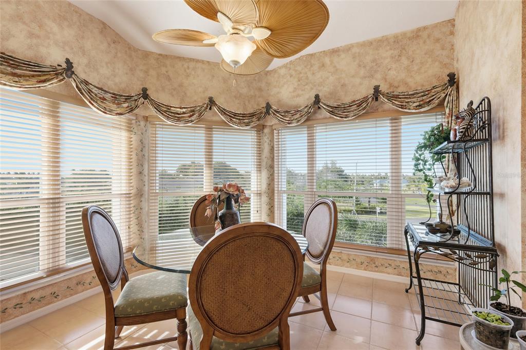11000 Placida Road, Unit 1504 Placida, FL 33946 - Photo 14 of 73 a dining room with furniture and a window