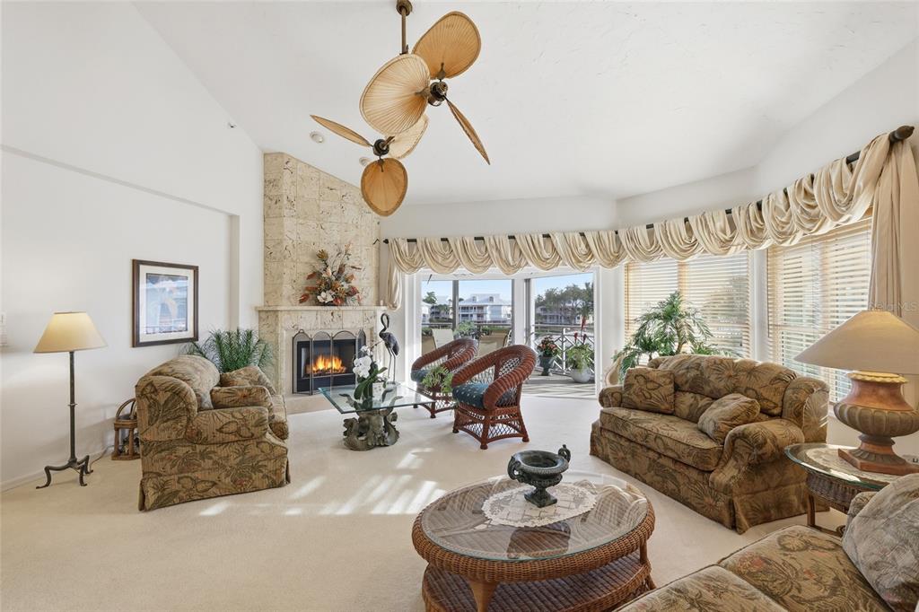 11000 Placida Road, Unit 1504 Placida, FL 33946 - Photo 22 of 73 a living room with fireplace furniture and a large window