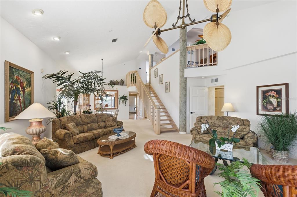 11000 Placida Road, Unit 1504 Placida, FL 33946 - Photo 23 of 73 a living room with furniture and a chandelier