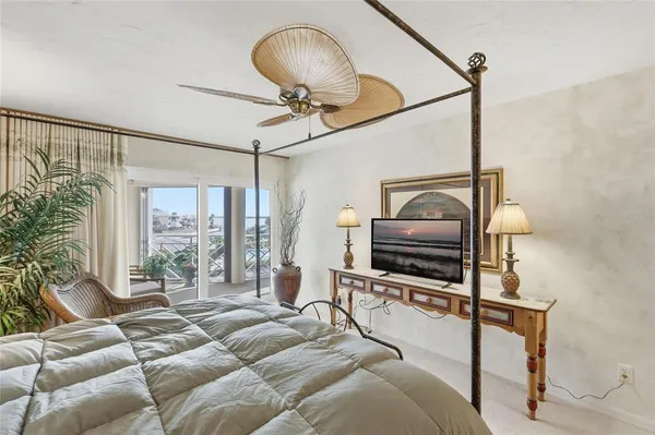 a view of a house with swimming pool and sitting area