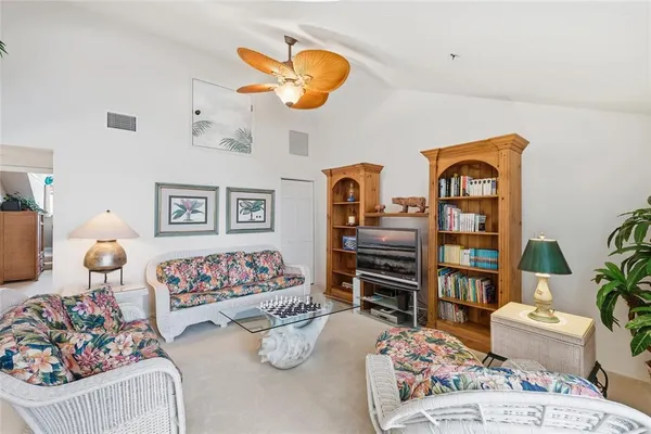 a swimming pool with outdoor seating and yard