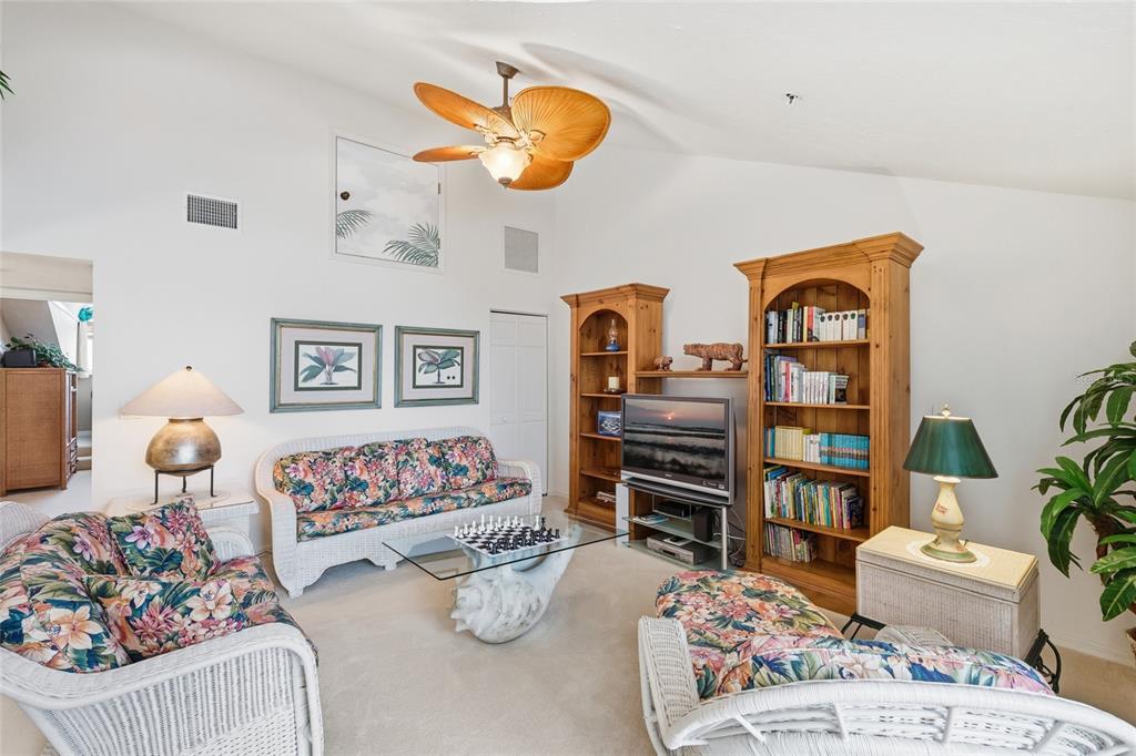 11000 Placida Road, Unit 1504 Placida, FL 33946 - Photo 31 of 73 a bedroom with furniture and book shelf