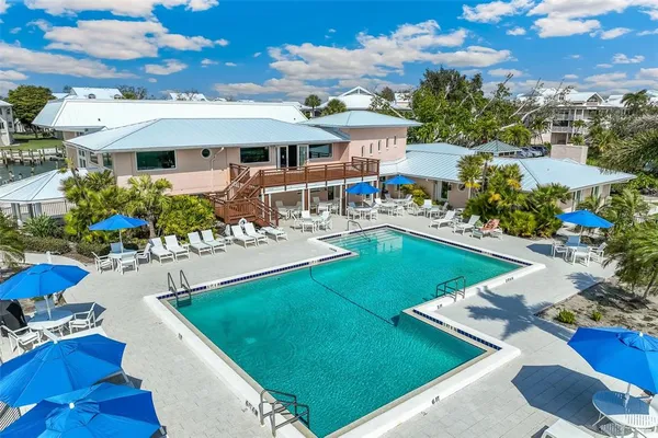 a view of a pathway both side of grassy field with shrub