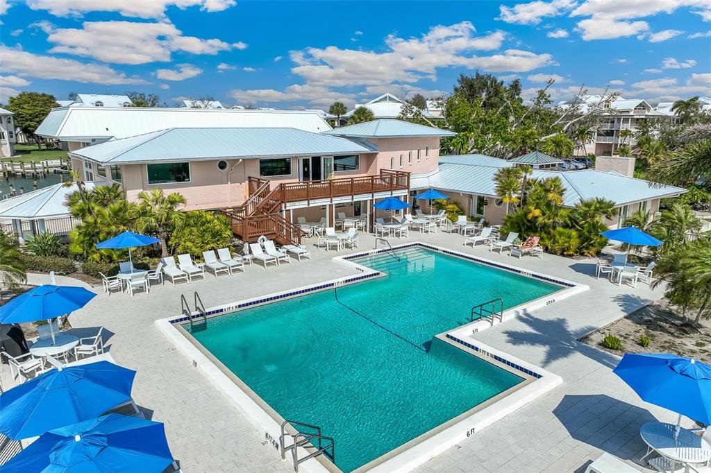 11000 Placida Road, Unit 1504 Placida, FL 33946 - Photo 41 of 73 a view of a house with swimming pool and sitting area
