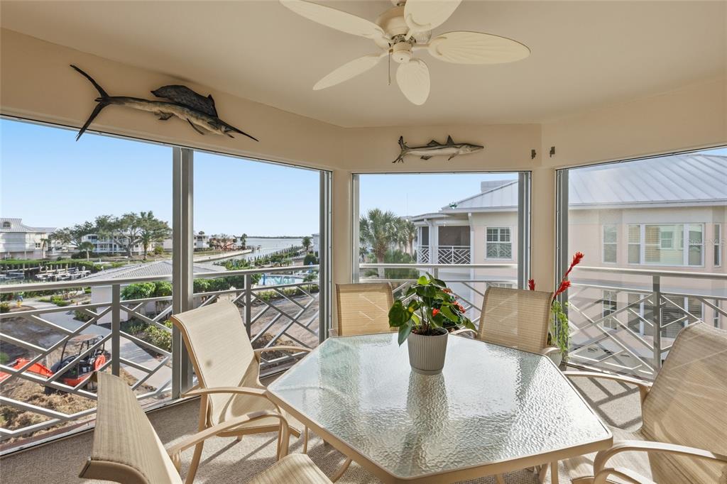 11000 Placida Road, Unit 1504 Placida, FL 33946 - Photo 6 of 73 a view of a dining room with furniture window and outside view