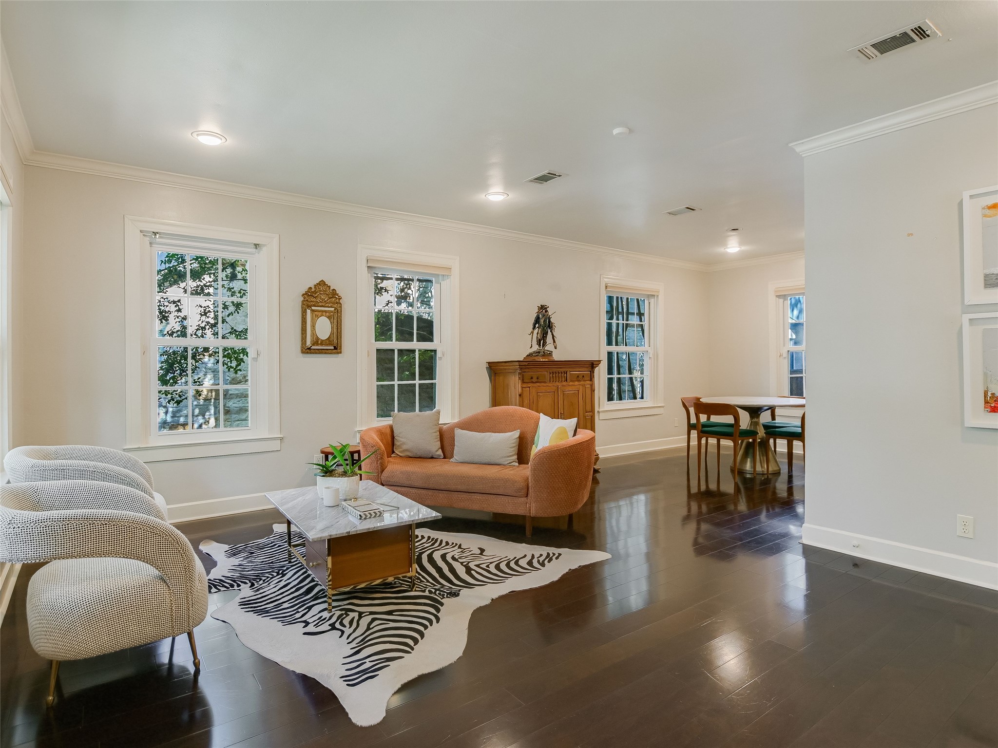 1804 Polo Road Austin, TX 78703 - Photo 4 of 19 Living room featuring dark wood-style flooring and ornamental molding