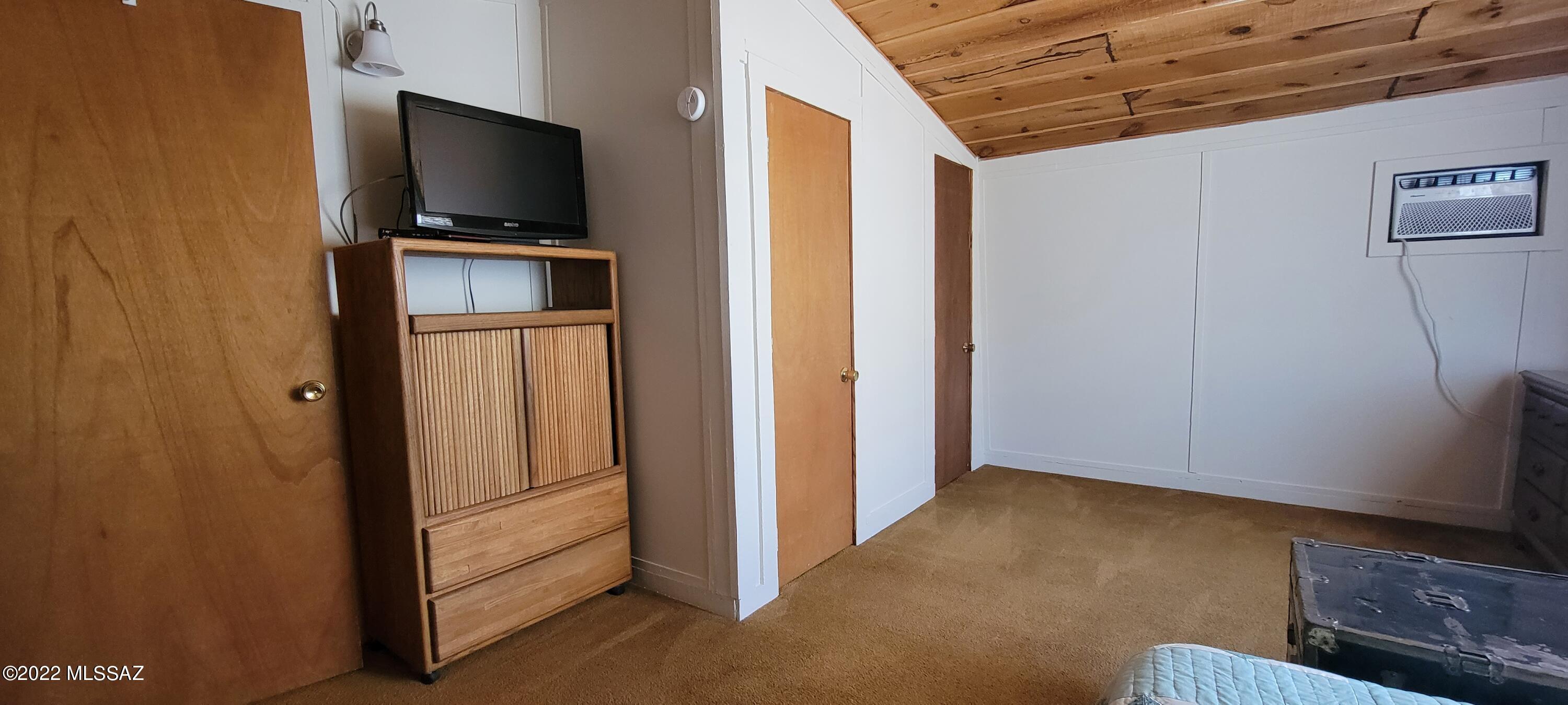 3399 Red Stag Road Pearce, AZ 85625 - Photo 31 of 47 a view of a livingroom with wooden floor and flat screen tv