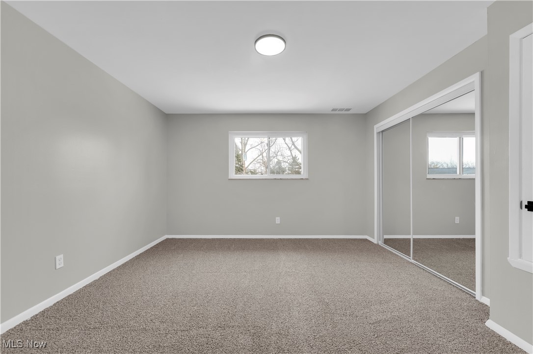 797 Babbitt Road, Unit 15 Euclid, OH 44123 - Photo 15 of 22 Unfurnished bedroom with light colored carpet and a closet