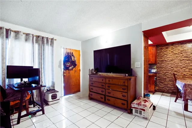 a view of living room with furniture and a flat screen tv