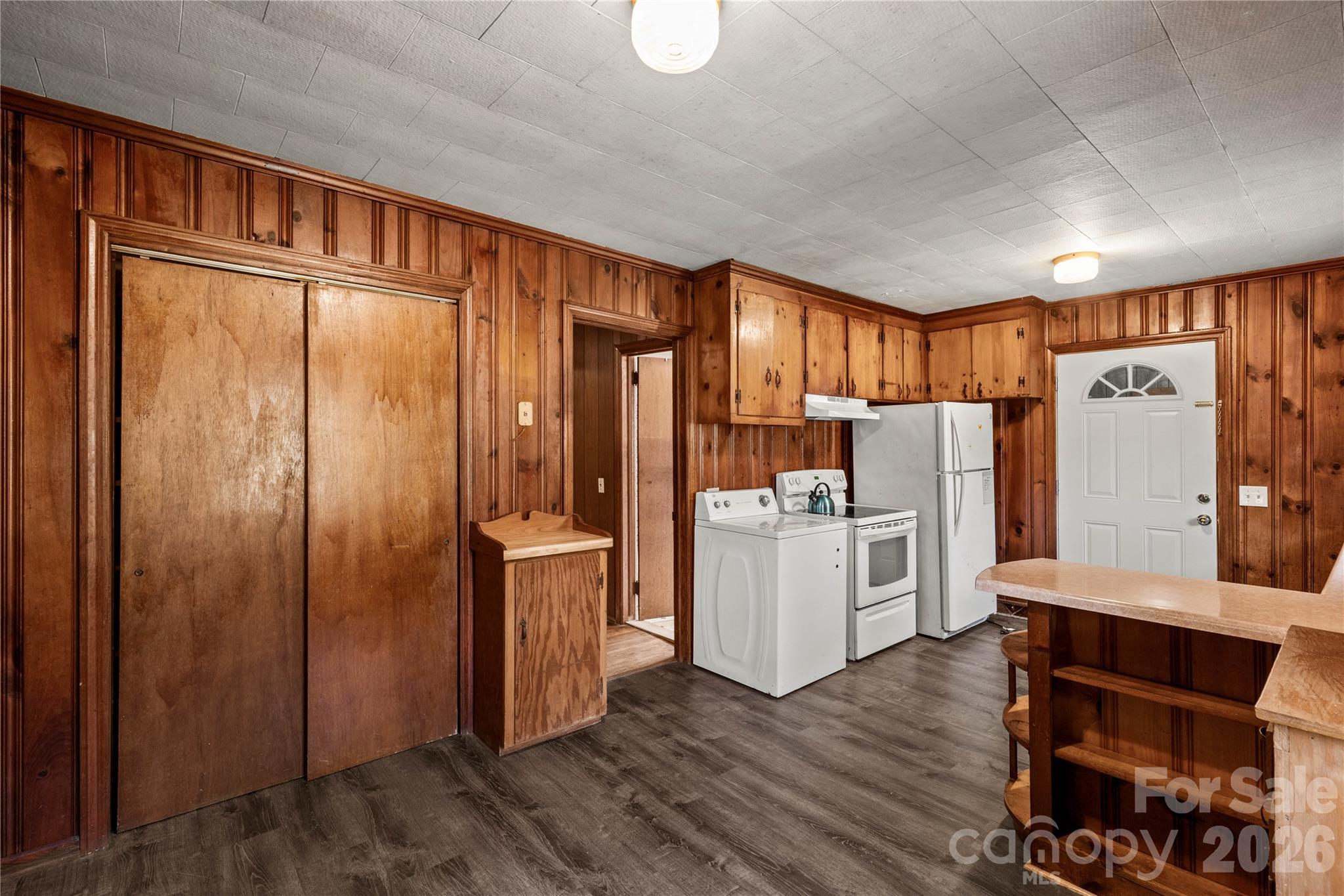 1724 State Rd S-29-39 Lancaster, SC 29720 - Photo 13 of 29 a kitchen with refrigerator a microwave oven a sink and dishwasher with wooden floor