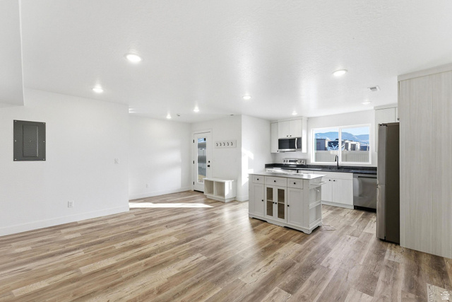 645 West 880th Street South Fillmore, UT 84631 - Photo 2 of 22 Open-concept living space featuring wood-finish flooring, recessed lighting, and a modern kitchen