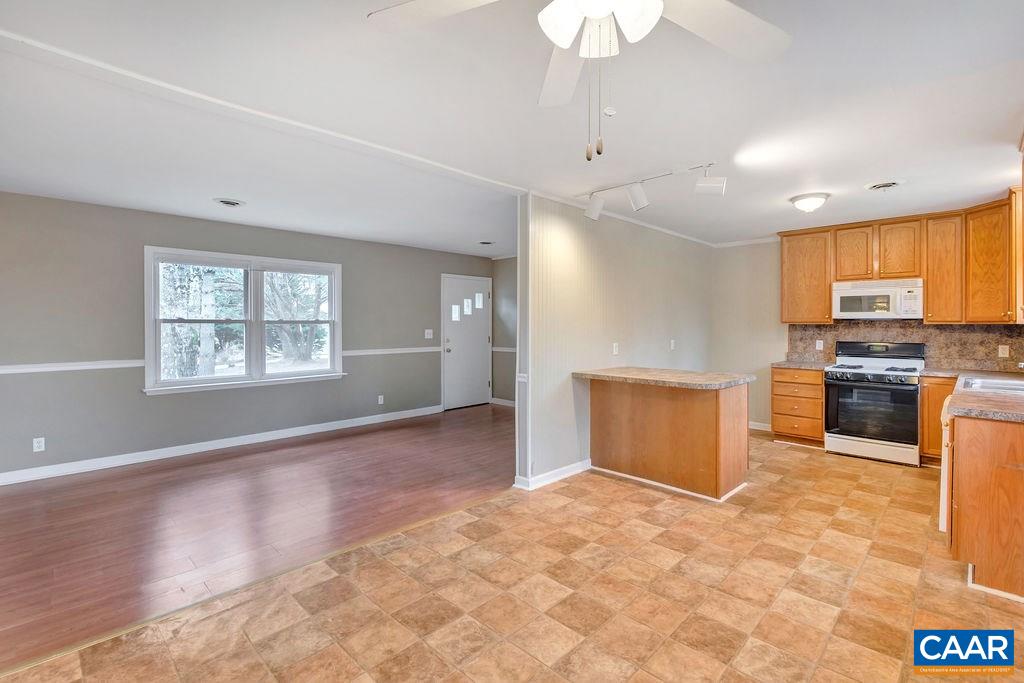 165 Rippin Run Road Ruckersville, VA 22968 - Photo 6 of 50 a view of kitchen with kitchen island microwave and stove top oven