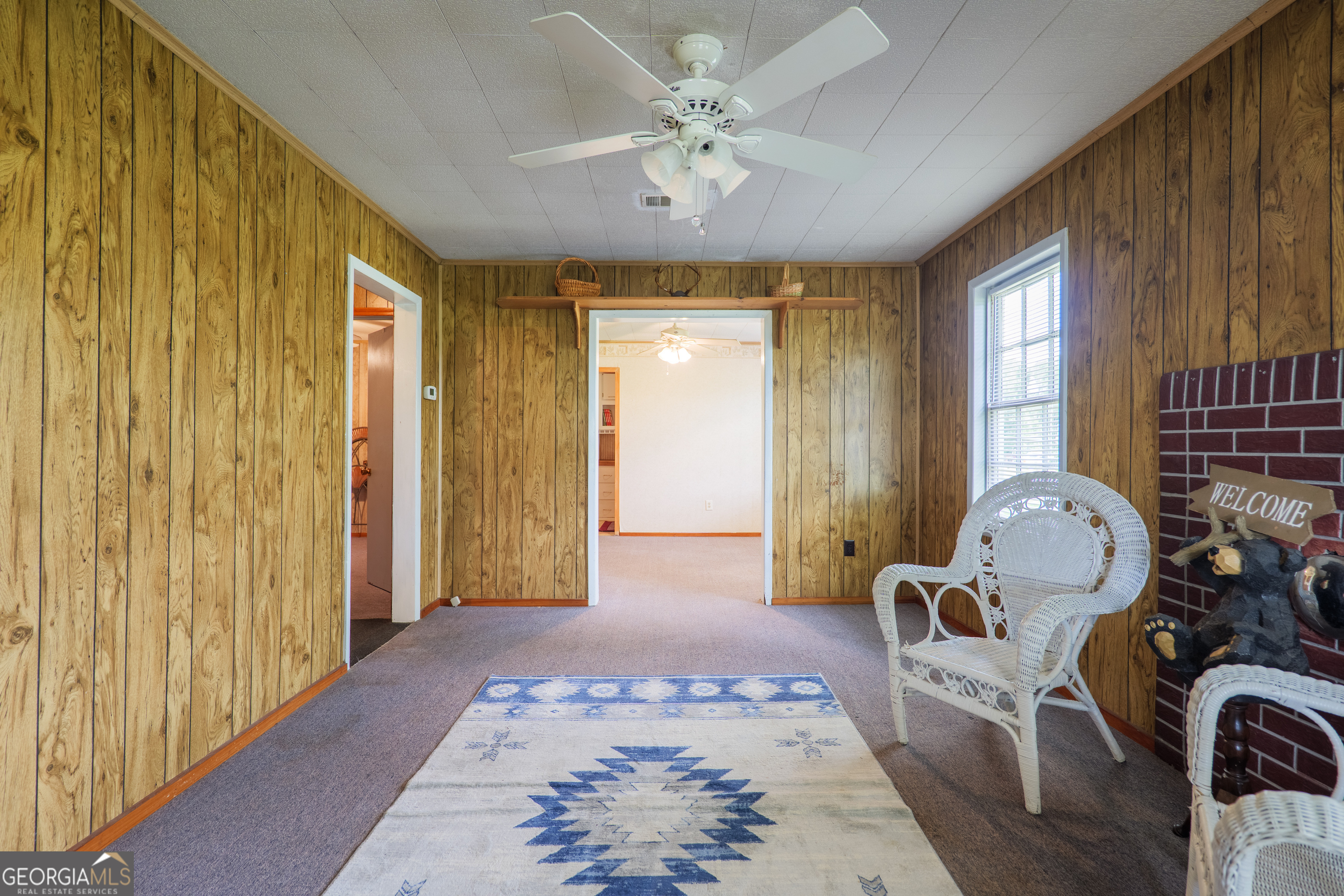 106 Nancy Avenue Fargo, GA 31631 - Photo 13 of 41 a living room with furniture and a chandelier