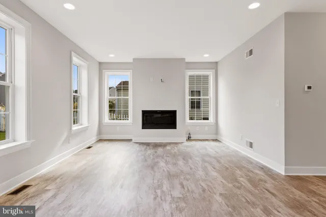 a kitchen with cabinets and window