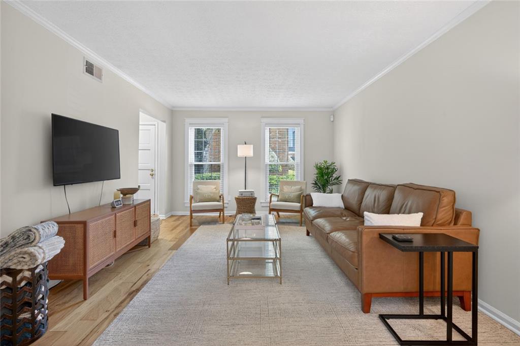 9 Scotland Place Northwest Atlanta, GA 30318 - Photo 12 of 49 a living room with furniture and a flat screen tv