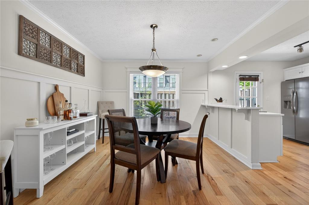 9 Scotland Place Northwest Atlanta, GA 30318 - Photo 13 of 49 a view of a dining room with furniture window and wooden floor