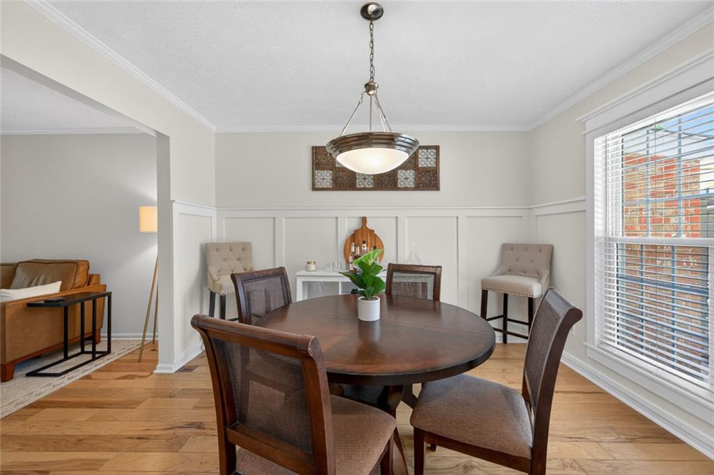 9 Scotland Place Northwest Atlanta, GA 30318 - Photo 14 of 49 a view of a dining room with furniture window and wooden floor