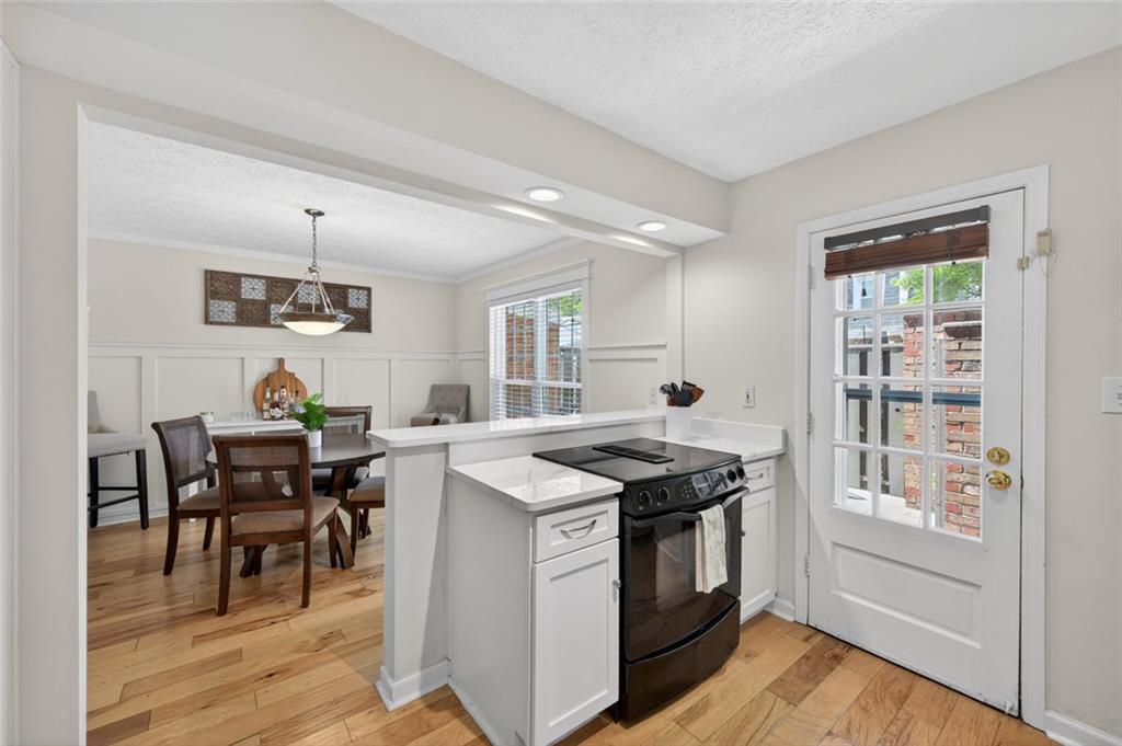 9 Scotland Place Northwest Atlanta, GA 30318 - Photo 17 of 49 a view of a dining room with furniture window and wooden floor