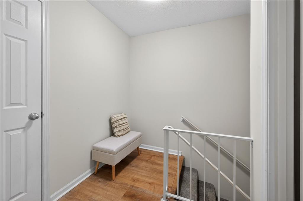 9 Scotland Place Northwest Atlanta, GA 30318 - Photo 21 of 49 a view of a hallway with wooden floor and a hallway
