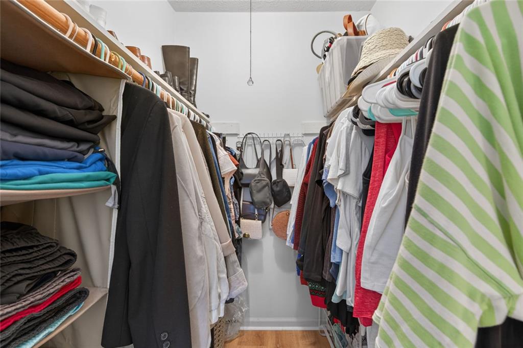 9 Scotland Place Northwest Atlanta, GA 30318 - Photo 24 of 49 a view of walk in closet with clothes and shoes