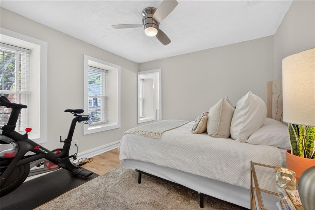 9 Scotland Place Northwest Atlanta, GA 30318 - Photo 25 of 49 a bedroom with a bed gym equipment and a desk