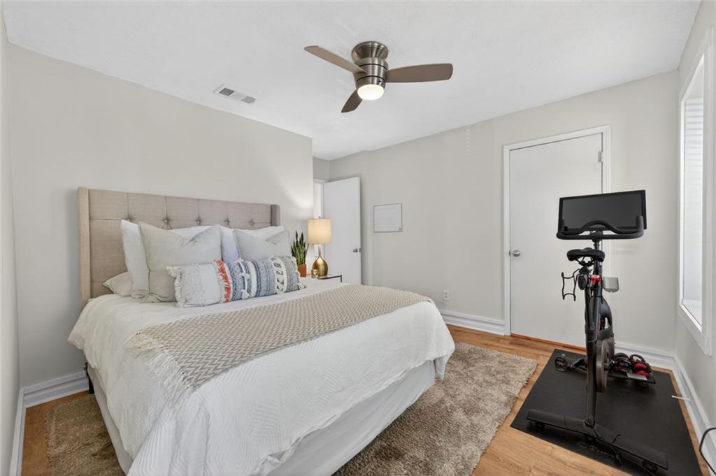 9 Scotland Place Northwest Atlanta, GA 30318 - Photo 26 of 49 a bedroom with a bed and a flat screen tv