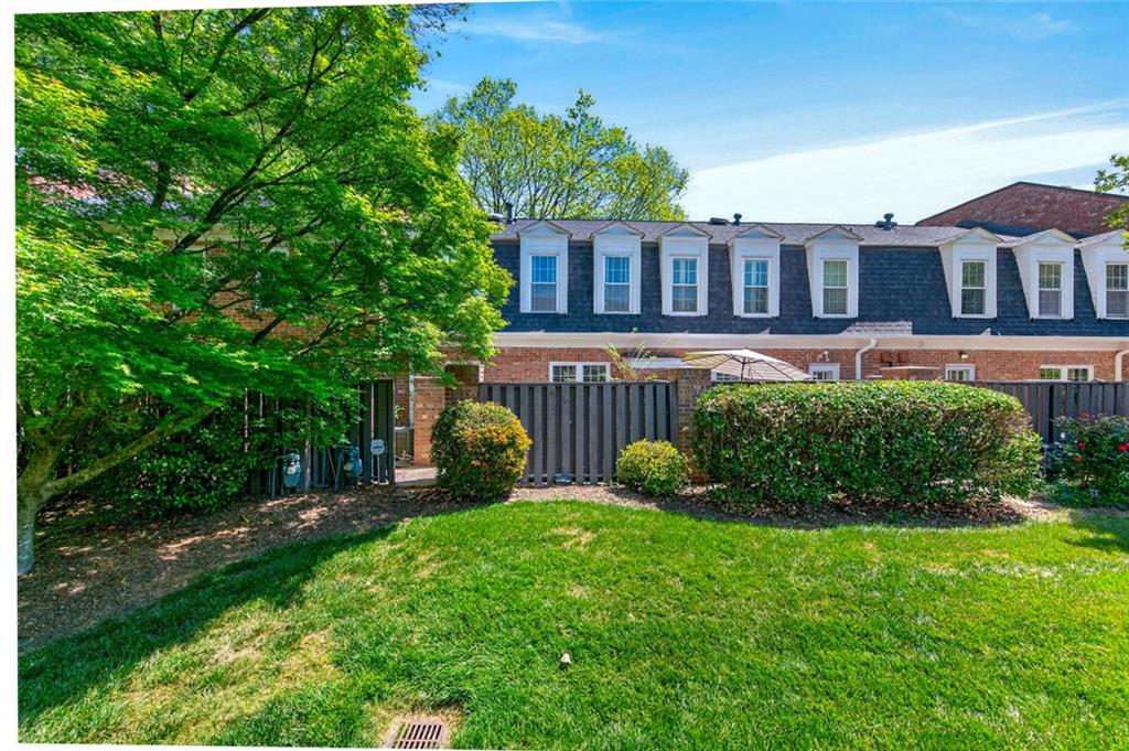 9 Scotland Place Northwest Atlanta, GA 30318 - Photo 29 of 49 a front view of a house with garden