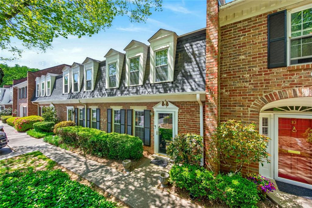 9 Scotland Place Northwest Atlanta, GA 30318 - Photo 31 of 49 a view of a brick building next to a yard