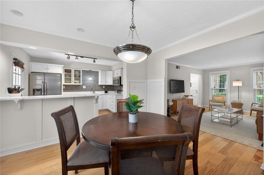9 Scotland Place Northwest Atlanta, GA 30318 - Photo 4 of 49 a view of a dining room with furniture window and wooden floor