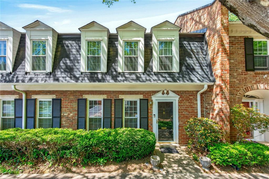 9 Scotland Place Northwest Atlanta, GA 30318 - Photo 49 of 49 front view of brick house with a large windows