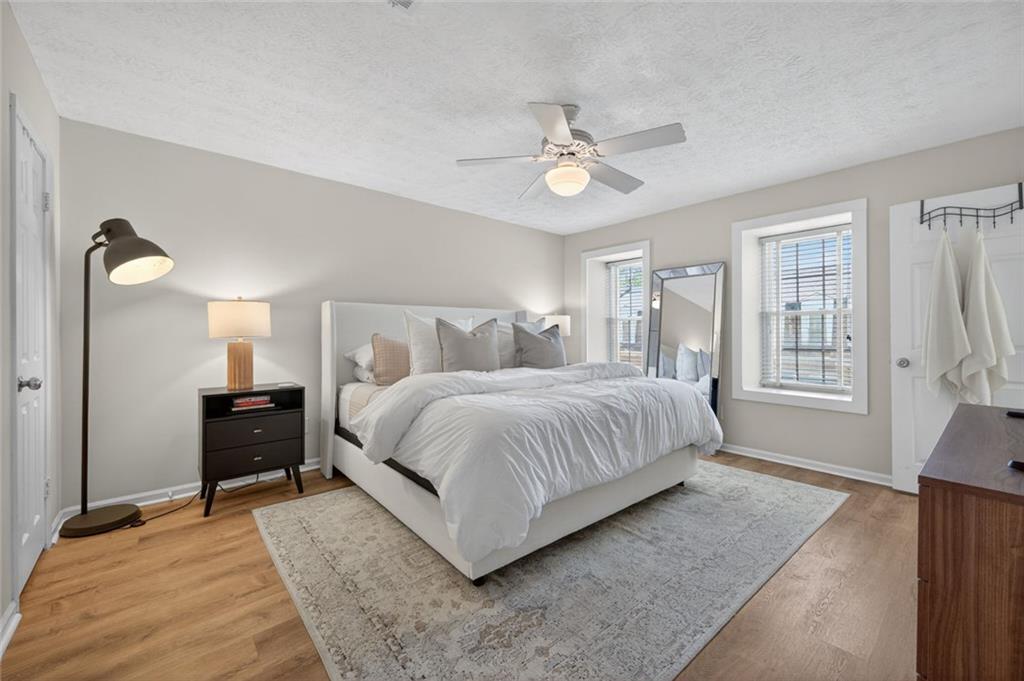 9 Scotland Place Northwest Atlanta, GA 30318 - Photo 5 of 49 a bedroom with a bed and wooden floor