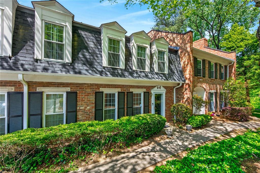 9 Scotland Place Northwest Atlanta, GA 30318 - Photo 8 of 49 front view of a brick house with a yard