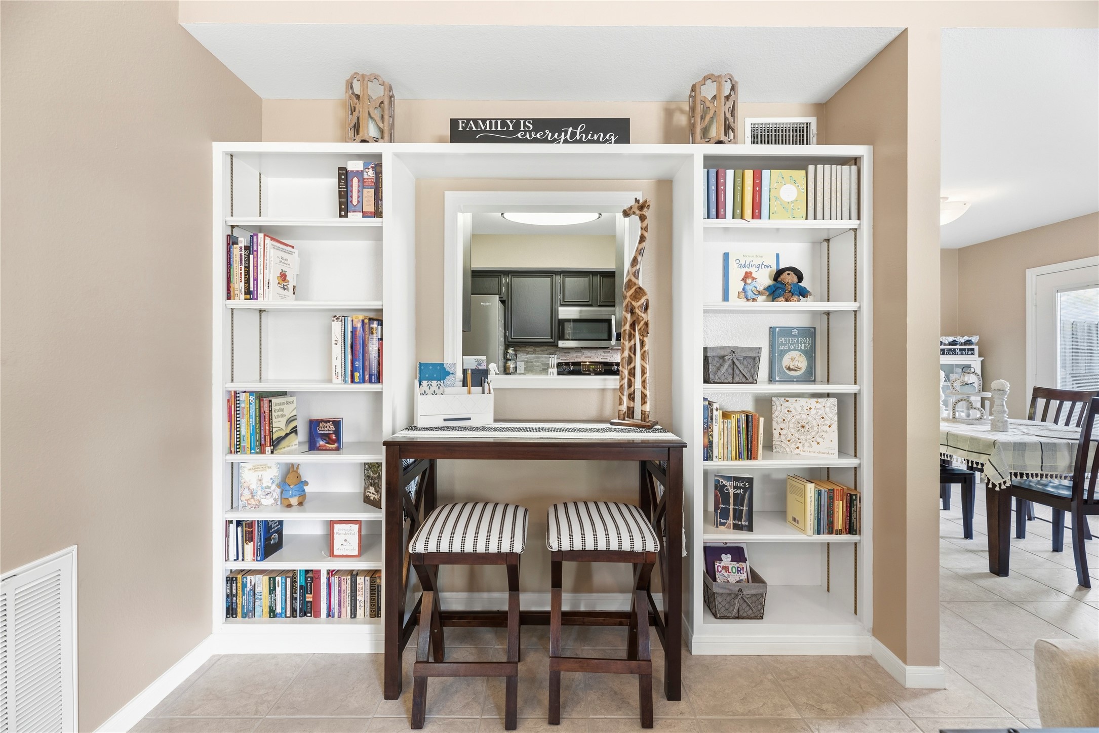 16913 Chapel Pines Drive, Unit 126 Spring, TX 77379 - Photo 7 of 27 This cozy nook features built-in white bookshelves framing a pass-through window to the kitchen.
