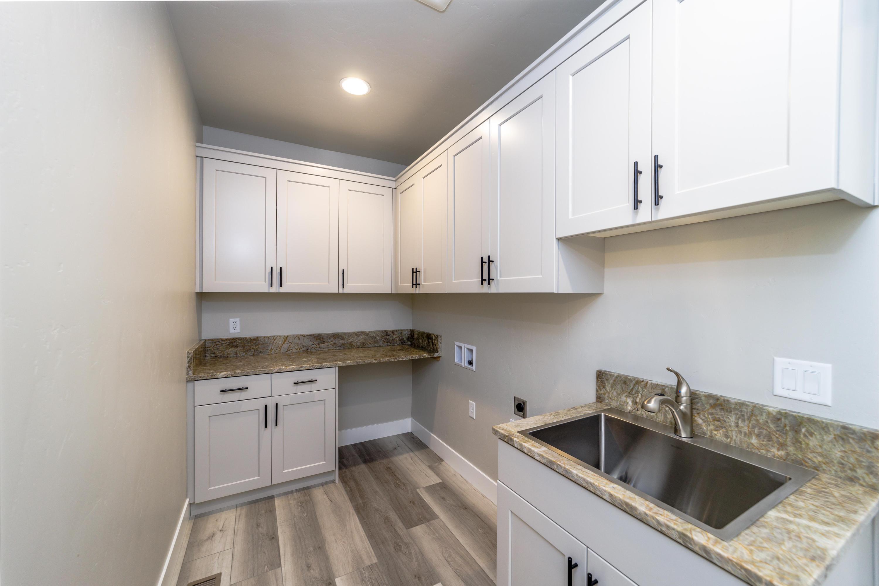 3679 Southwest 45th Street Redmond, OR 97756 - Photo 21 of 41 Utility room with soft close cabinets