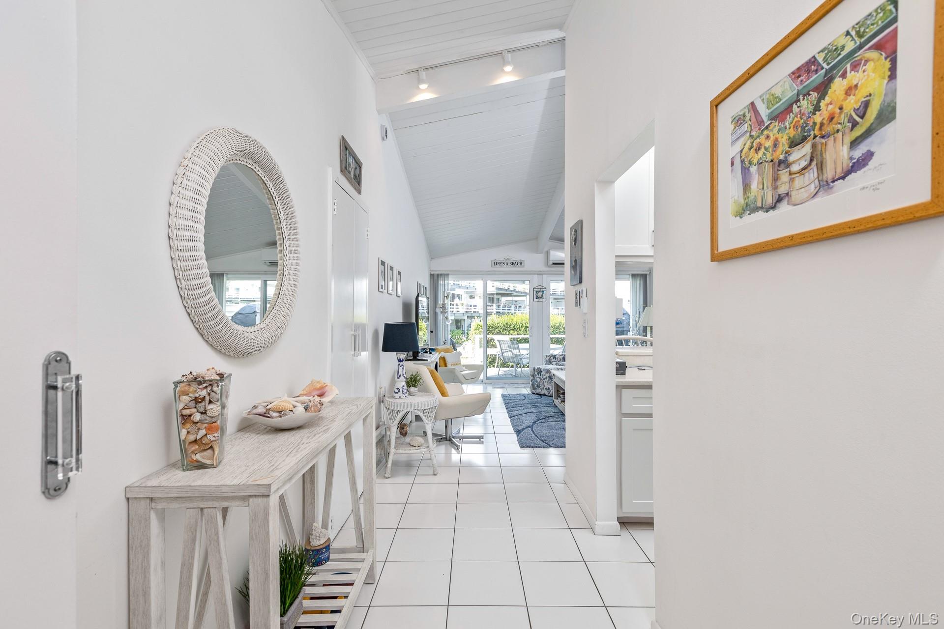 Vaulted ceiling Entry Foyer with recessed lighting, and Ceramic tile flooring